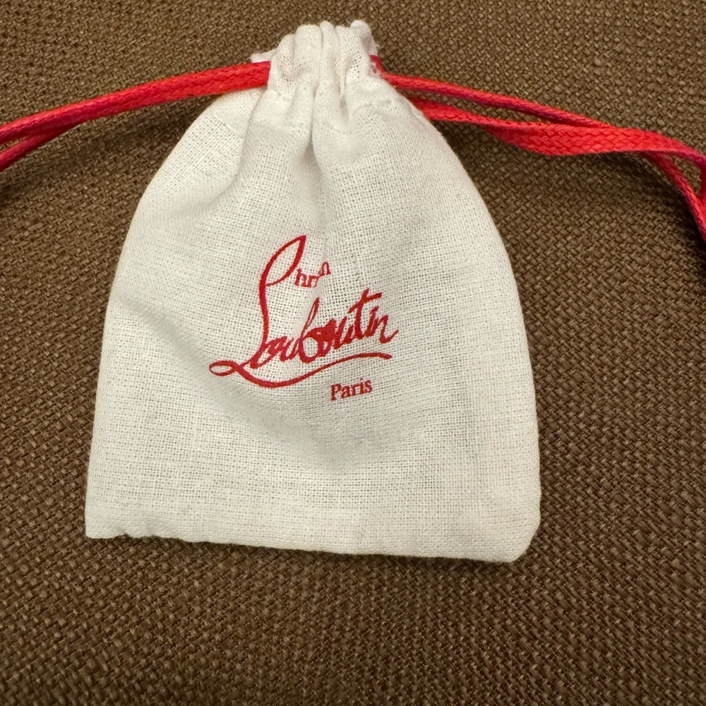 Christian Louboutin extra heel replacements with the pouch.